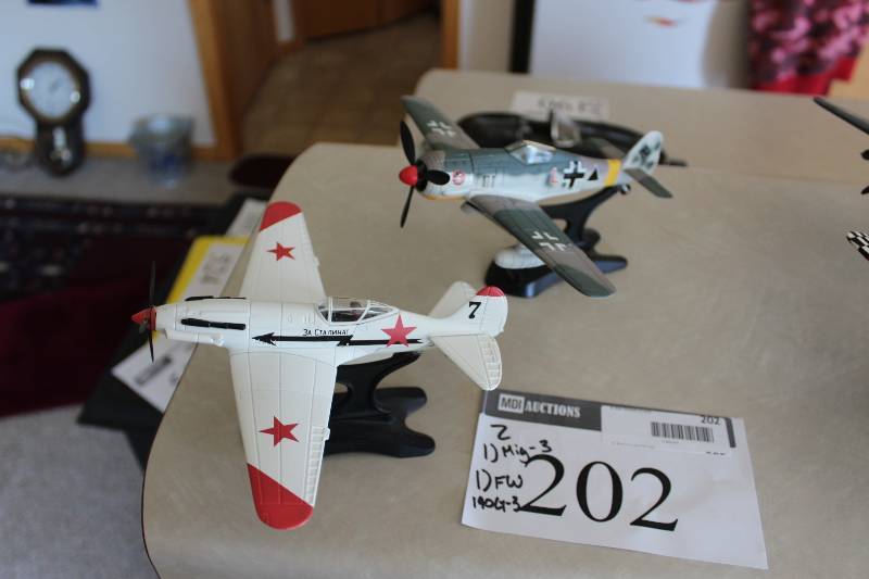 lot 202 image: Lot of (2) Collectible Toy Planes Including Mig-3 FW 190G-3.