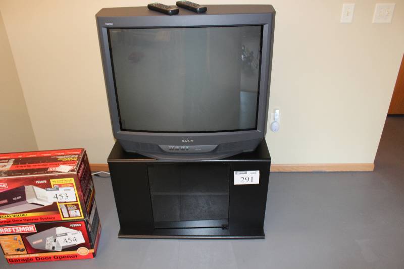 lot 291 image: Lot of (2) Including Television Television Stand wLower Shelves.