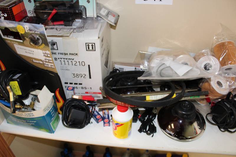 lot 341 image: Shelf Lot Including Air Filters Belts Charger And More.