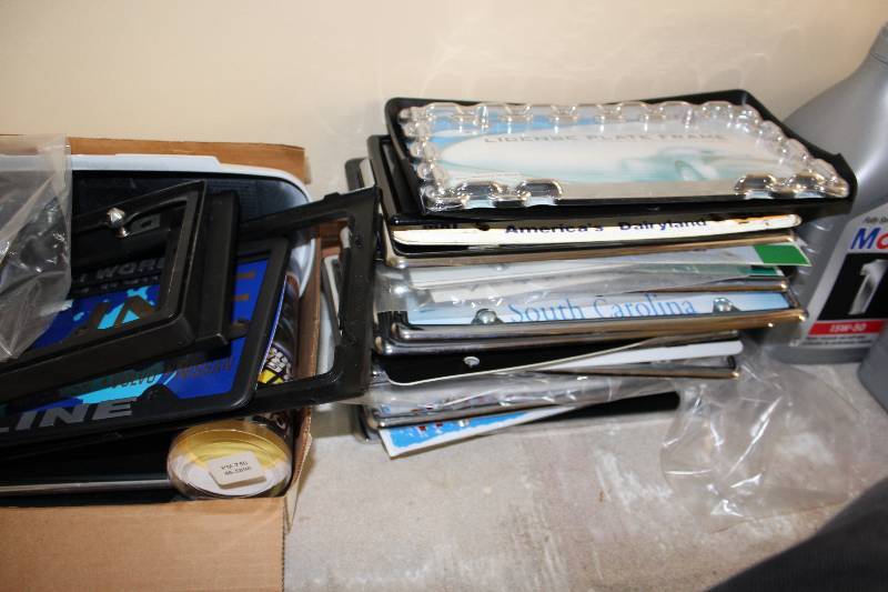 lot 303 image: Shelf Lot of License Plate Covers & License Plates.