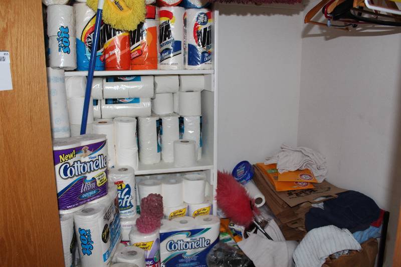 lot 455 image: Top Half Of The Closet Including Toilet Paper Mop Paper Towels And More.