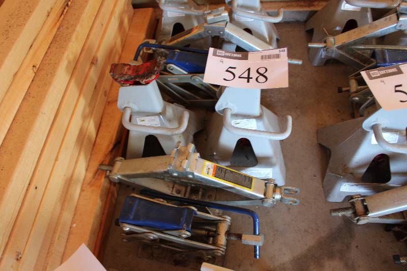 lot 548 image: Lot of (4) Including Tire Stands Car Jacks.