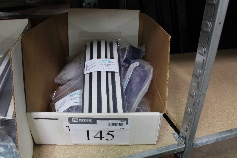 lot 145 image: Kinter Box Lot Including Gripper Sign Holder Label Holder For Wire Fixtures Universal Adjustable Grippers And More.