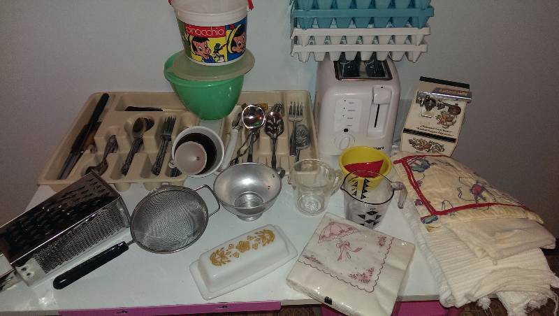 Silverware, knives, toaster, can opener, ice cube trays, and misc kitchen items
