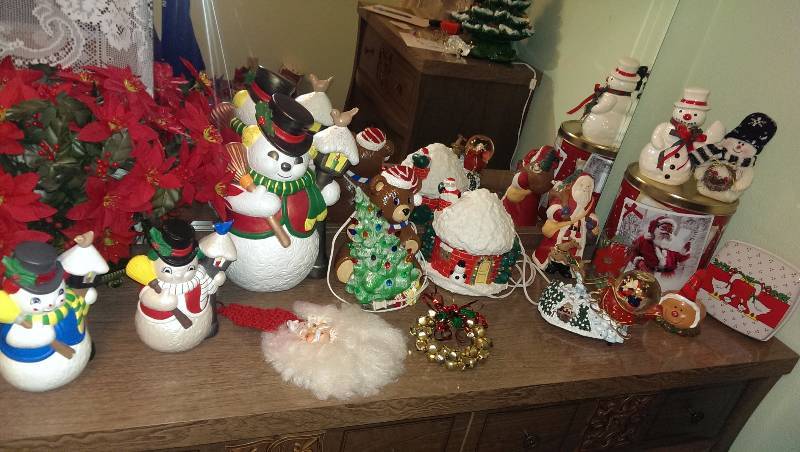 Two Christmas lighted decorations, snowman decorations, music box santa globe, misc