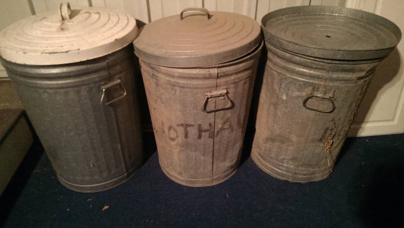 Three aluminum garbage cans with lids