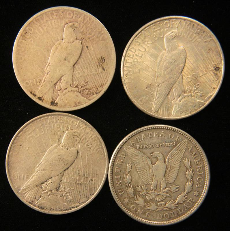 lot 29 image: GROUP OF 4 MORGAN-PEACE SILVER DOLLARS AS PICTURED