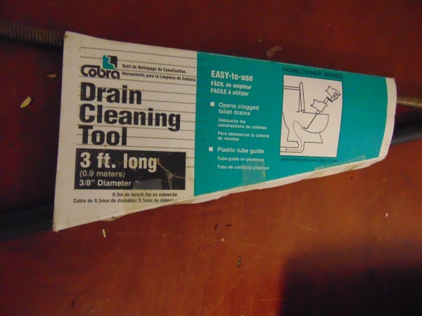 lot 31 image: Drain Cleaning Tool and Oil Heater Stick