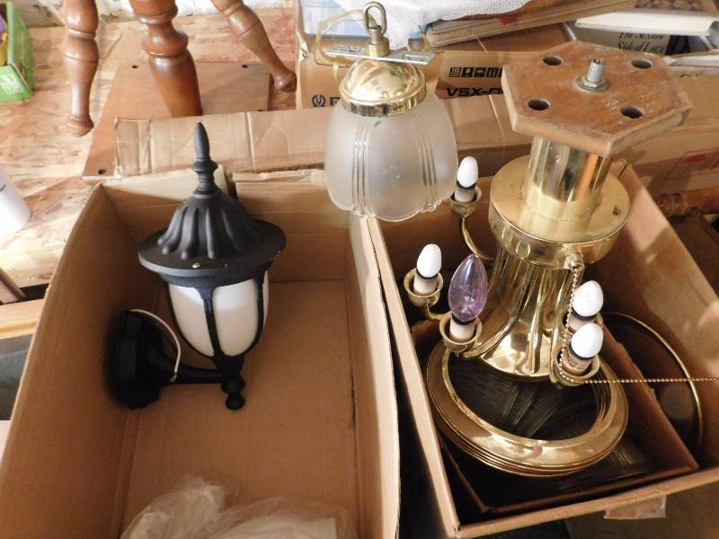 box of light fixtures and parts