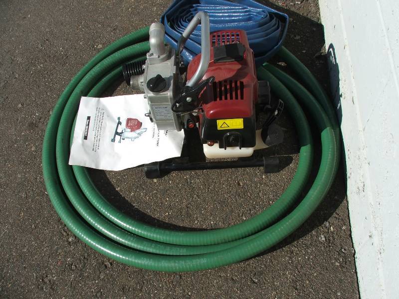 Gas Powered Water pump, new with manual and hoses