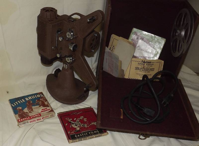lot 19 image: Universal Cinematic 8 MM Projector Camera PLUS Movies
