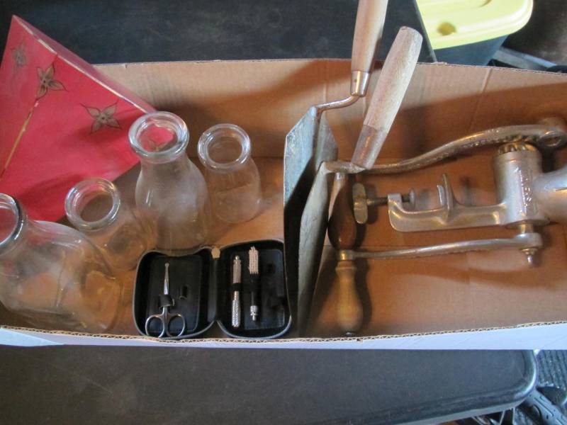 Meat grinder, cement trowels, milk jars, shelf, toothbrush