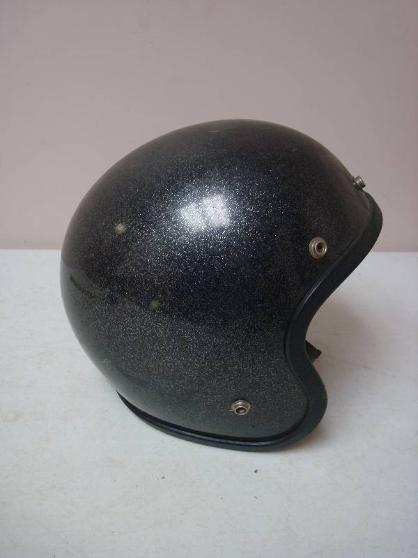 lot 15 image: Vintage Black Metal Flake Motorcycle Helmet, Shows Wear