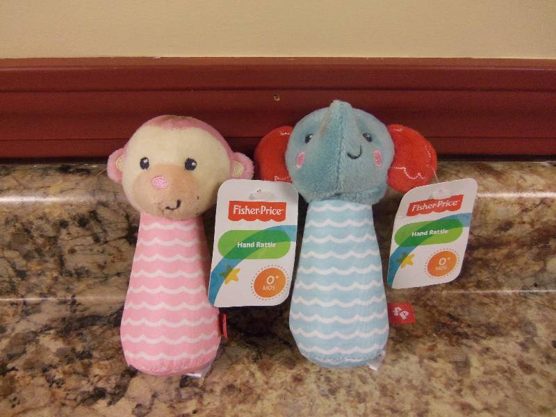 lot 13 image: Fisher Price Hand Rattles- Set of 2