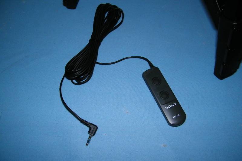 lot 83 image: Sony, HandyCam  Video Cam, Camera Tripod and Remote Control