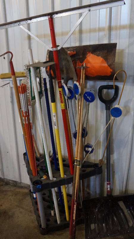 lot 55 image: Lawn & Garden Tools with Garage Organizer, 2 Pool Cues & Reflectors