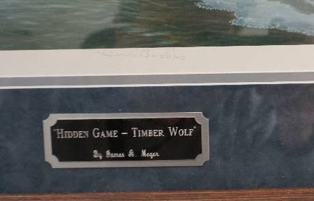 lot 10 image: James A Meger Hidden Game Timberwolf Wildlife and Pond Hockey Themed Framed Print