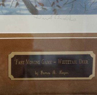 lot 11 image: James A Meger Fast Moving Game Whitetail Deer Wildlife and Pond Hockey Themed Framed Print
