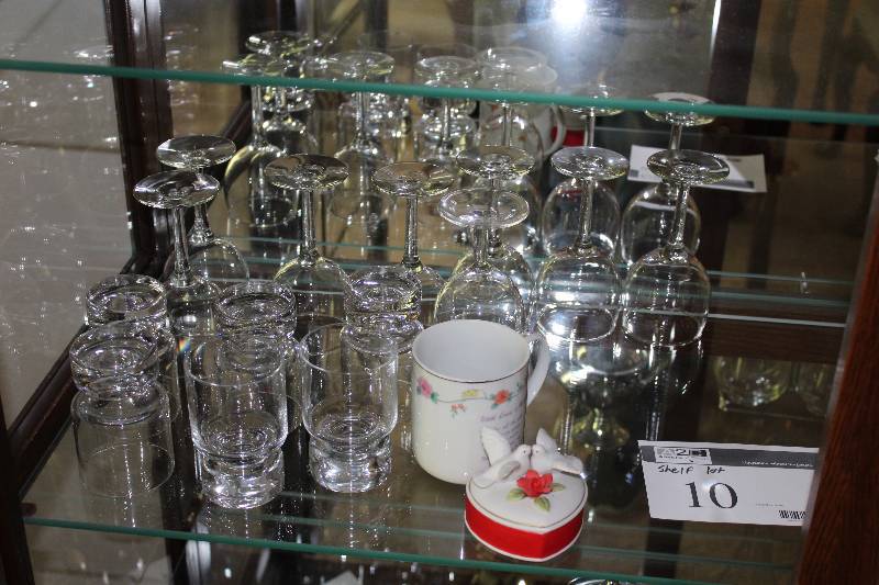 Shelf Lot of Glassware Including Cups Wine Glasses And More.