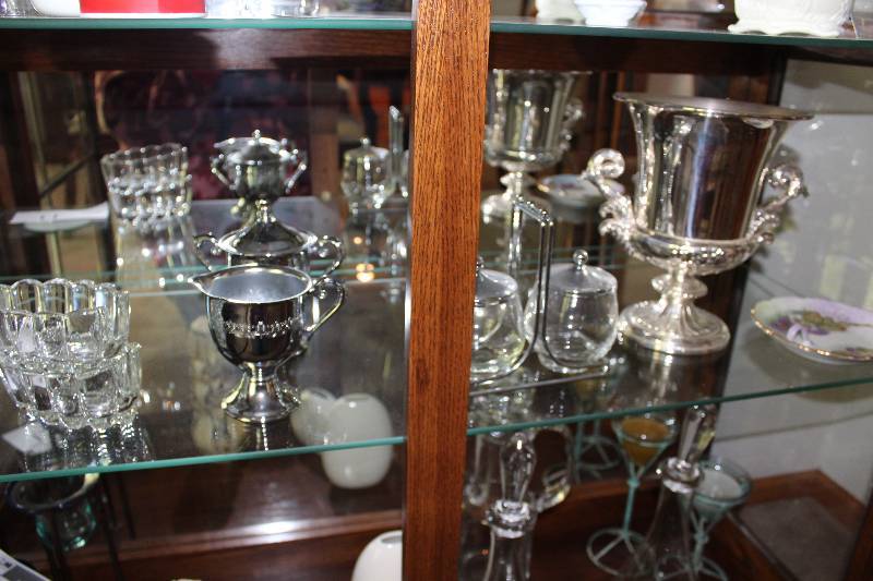 Shelf Lot Including Metal Champagne Holder Glassware And More.