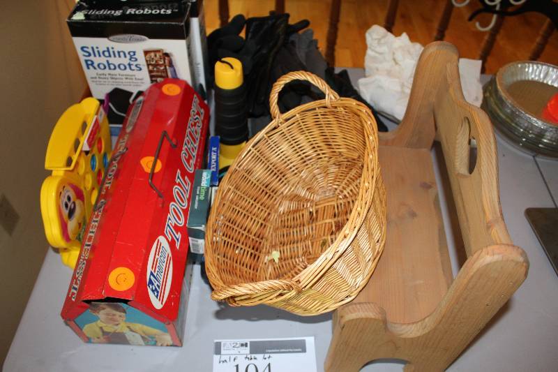 Half Table Lot Including Sliding Robots Tool Chest Wicker Basket And More.