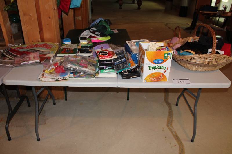 Table lot Including Wicker Baskets Dog Dish VHS Tapes Games And More.