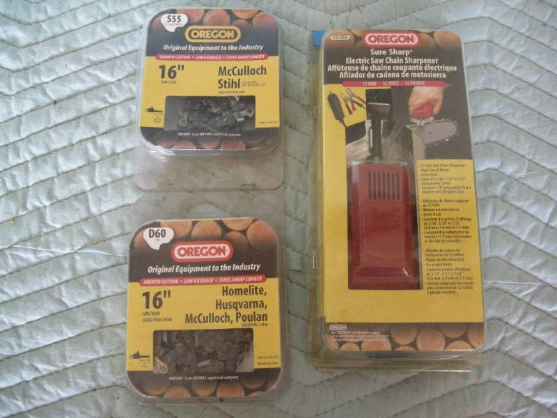 lot 60 image: Oregon Chainsaw Chain Sharpener & 2 New Chains