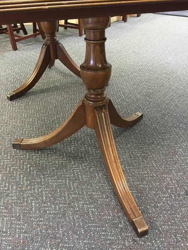 Vintage Walnut Henredon table with seven chairs.