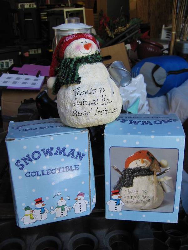 Pair of poly-resin snowmen. There...