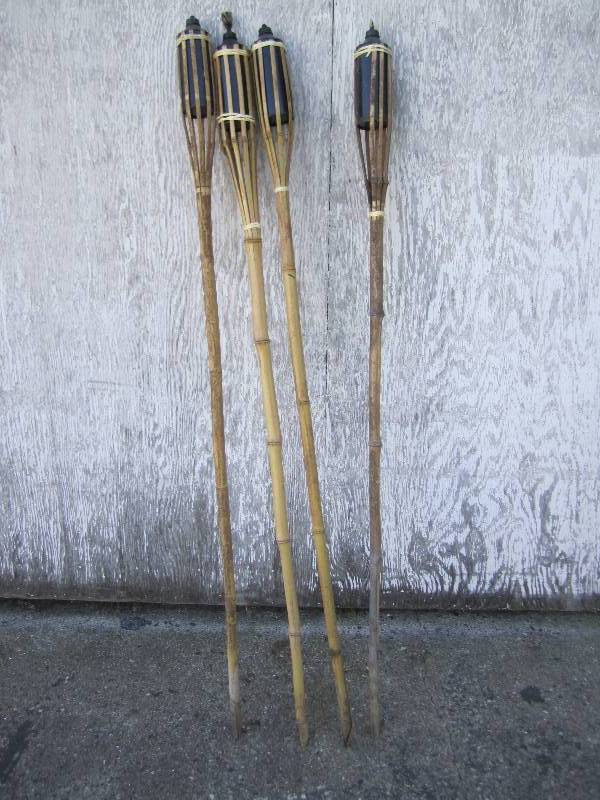 Lot of 4 tiki torches with oil tank...