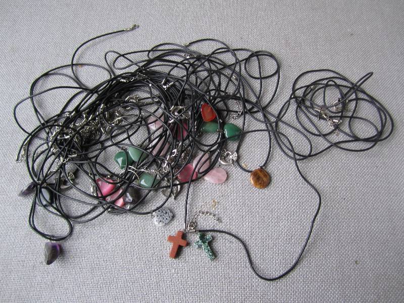 Lot of necklaces with shapes and st...