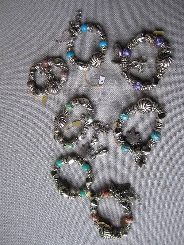 Lot of charm bracelets priced at $1...