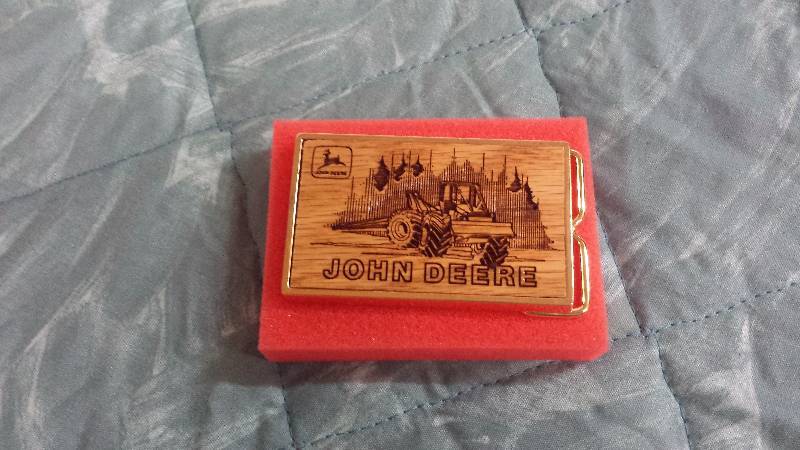 lot 80 image: John Deere Engraved Wood Face