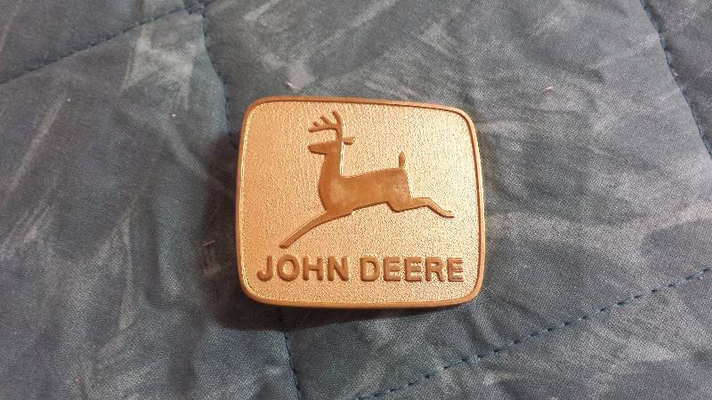 lot 123 image: John Deere Gold Buckle