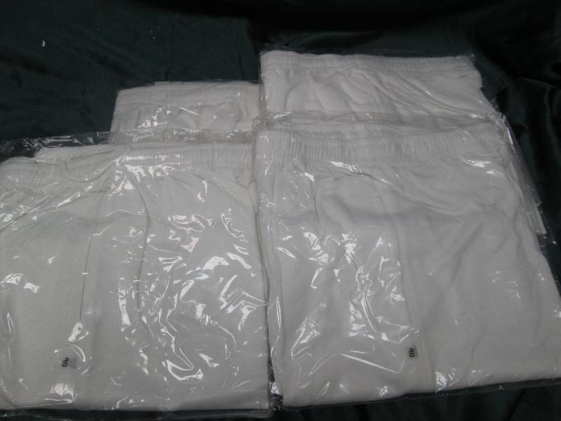 Qty 4 White pants size 40...