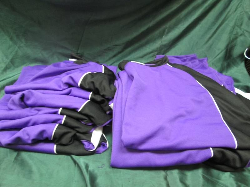Qty 14 Purple and black shirts size...