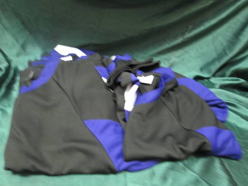 Qty 9  Black and purple jerseys siz...