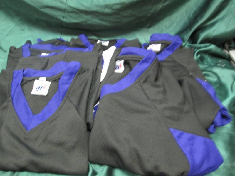 Qty 9  Black and purple jerseys siz...