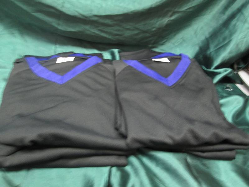 Qty 6  Black and purple jerseys siz...