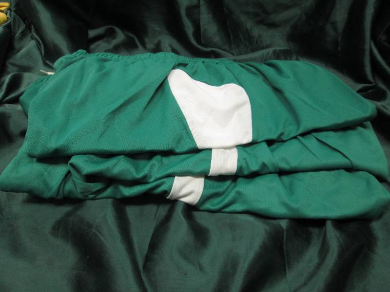 Qty 8 Green and white shorts size M...