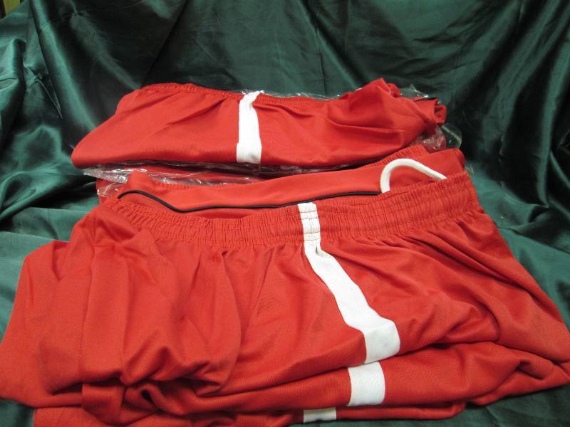 Qty 9 red, white, and black shorts ...
