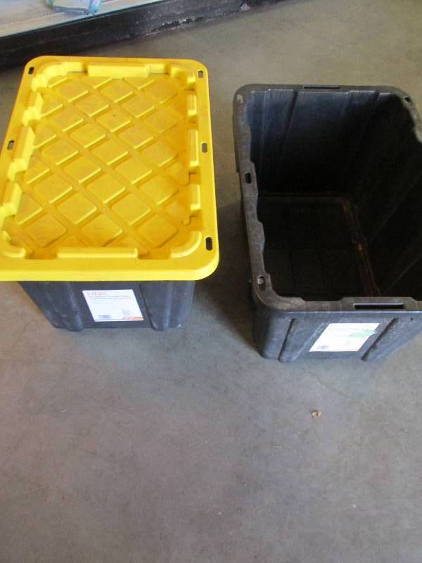 2 sturdy plastic totes, one with a ...