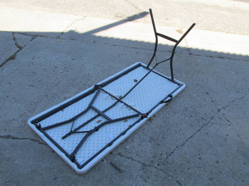 Folding table with a carry handle, ...