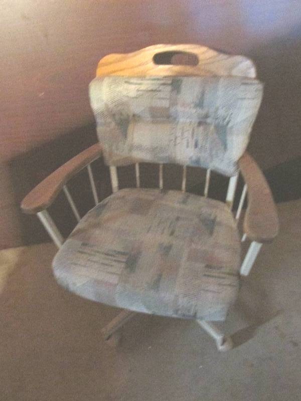 Upholstered wood chair on caster wh...