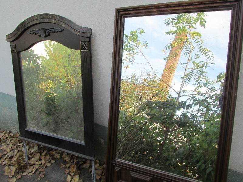 2 mirrors with supports to top a dr...