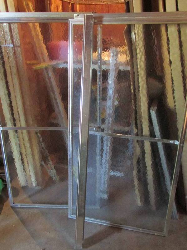 Double sliding shower doors, each d...