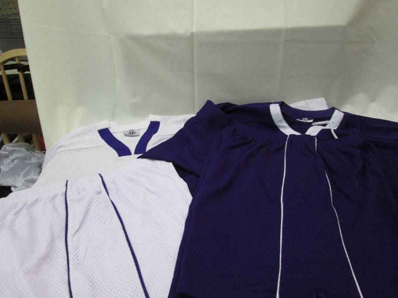 Dark purple jersey with white pinst...