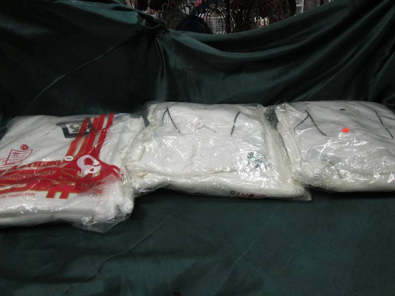 3 different shirt and pants sets si...