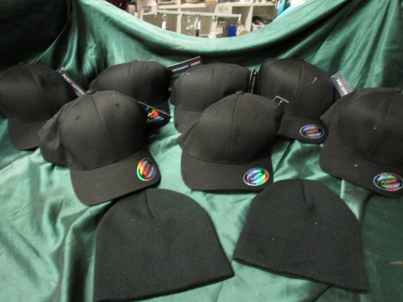 7 black base ball caps and 2 black ...