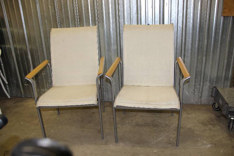 2 metal chairs with canvas-like seats